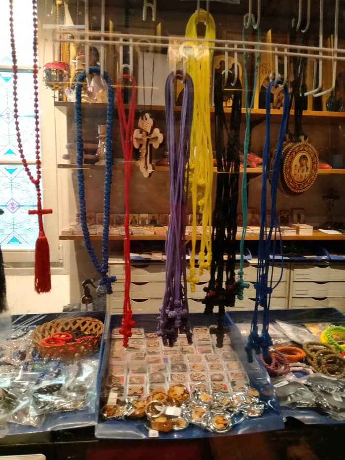 Oftentimes, Bogoroditsa would ask me to buy her necklaces from the kiosk, bring them to her and her son or leave them somewhere outside. Mary says she disperses dark spells with these. According to the clerk the crosses are imported from Serbia.