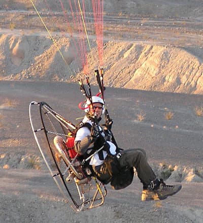 This is how the paramotors look like. A parachute holds the whole motor and person from above.