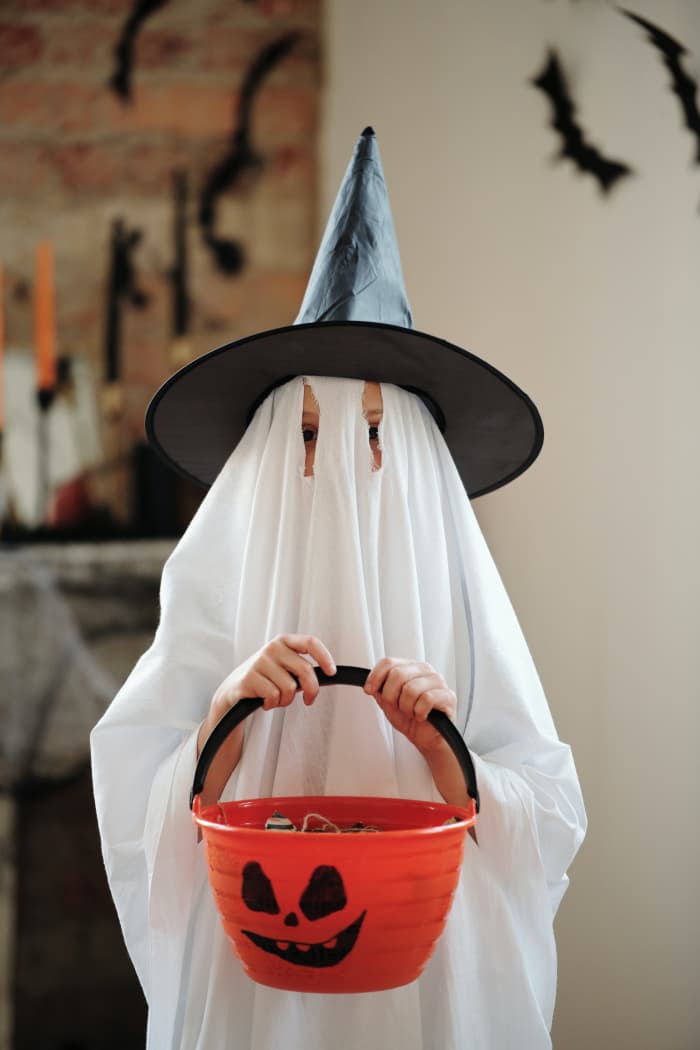 Kids will enjoy their candy stash on Halloween night after the candy scavenger hunt. Photo by Daisy Anderson from Pexels