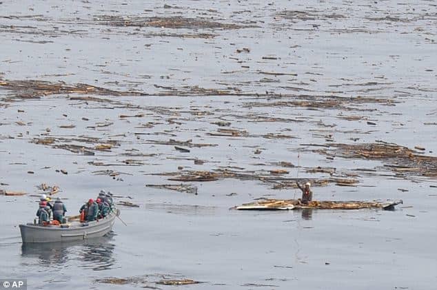 This man was rescued 10 miles out at sea after he stood on the roof of his house and later used it as a raft when a tsunami struck Japan in March 2011