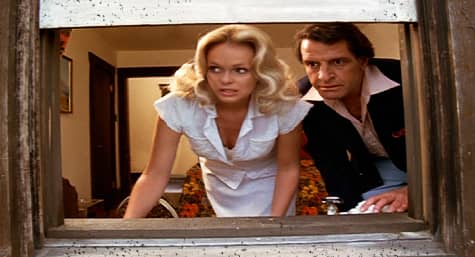 Valerie (Lynda Day George) and Tony (Gerald Gordon) watch as rescue crews figure out how to get them out of Lakewood Manor