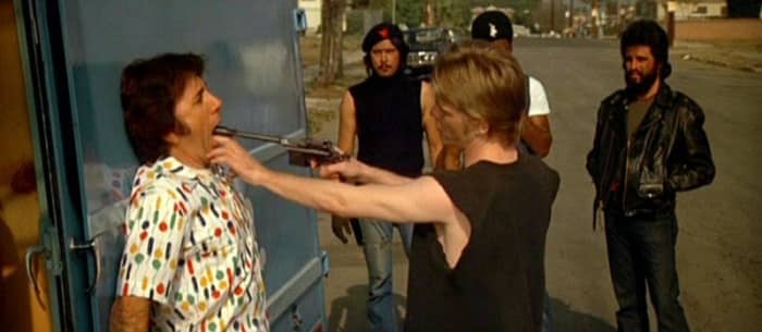 The build-up to the actual confrontation quickly builds up the tension including a notorious scene with an ice-cream van that depicts a shocking and callous act of violence.