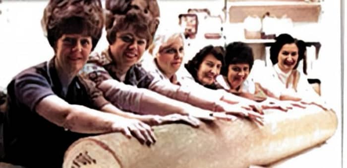 The ladies rolling the giant stick of rock. The factory forewoman, Yvonne Caldwell, is second from the left.