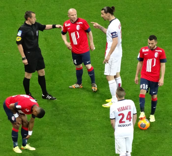 The referee may point at a player while talking with them as a warning, especially if the player is arguing.