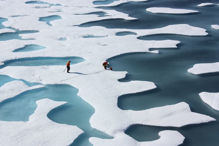"Ponds on the ocean." ICESCAPE investigators work Arctic Ocean melt ponds, July 2011. Photo courtesy NASA and Wikimedia Commons.