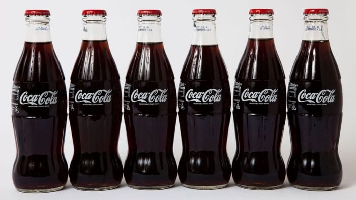 In 1949, Coca-Cola cost five cents a bottle, 25 cents for a six-bottle carton, and $1.00 for a 24-bottle carton.