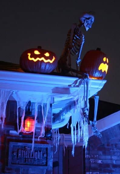 Place a skeleton with its legs dangling off your eaves for an extra scare. Visitors will do a double-take when they look up!