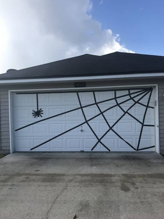 This is such a cool use for black painters' tape! The web is super easy to make, and it will peel right off afterwards!