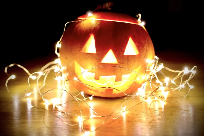 If this carver had cut the hole from the bottom, they could tuck away the cord of these wired lights so no one would ever see it.