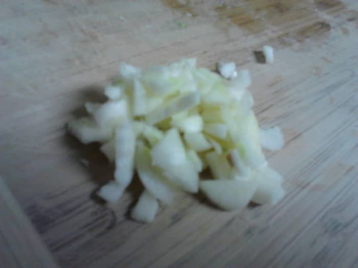 Chop the garlic fine as you can with a kitchen knife if you do not have a garlic press.