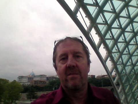 yours truly on said bridge, with the georgian president's official residence over right shoulder