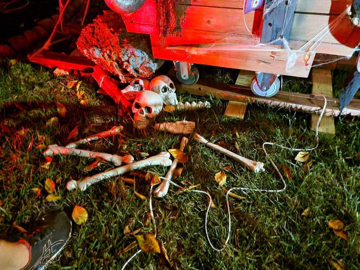 Creepy skeleton bones next to the rail car and railroad tracks for the mining scene.