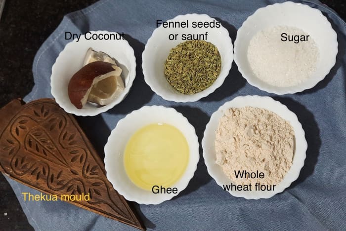 Simple ingredients: whole wheat flour, sugar, ghee or refined or vegetable oil, fennel seeds, dry chopped coconut, thekua mould