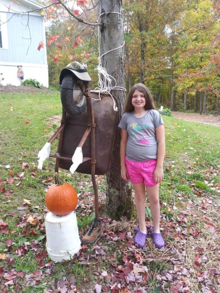 My daughter took this picture of my granddaughter, Leah and her scarecrow she did for a school contest. His name is Barrow, Will Barrow.