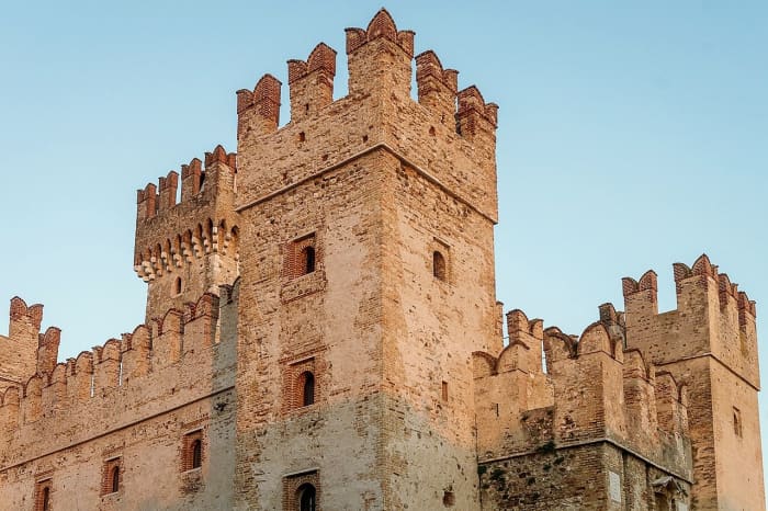 The castle in the story has a drawbridge and is surrounded by a moat. This is Scaligero Castle in Italy.