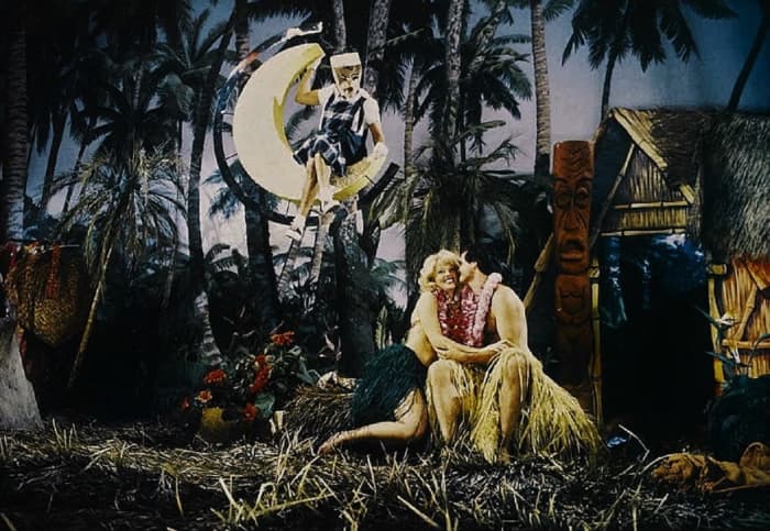 Walter Baylor (Blackie Dammett) sits in the moon as he plots to murder Cindy (Misty Rowe) and Jeff (Randolph Powell) at their class reunion