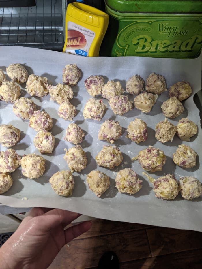 flour hands and roll into balls. Freeze. I used parchment paper. Last time I used wax paper and the balls stuck.