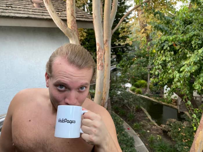 I'm pretending to sip a beverage from the cup, because I guess this is what normal people do when they receive a mug.