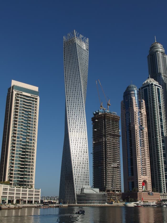 The World Headquarters of the Global Interstellar Bank Conglomerate of Dubai, in the United Arab Emirates. (The bank building is the curvy one.)