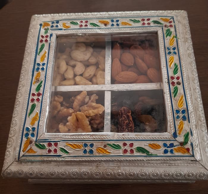 Dry fruits are packed in attractive hand crafted silver boxes as Diwali gifts