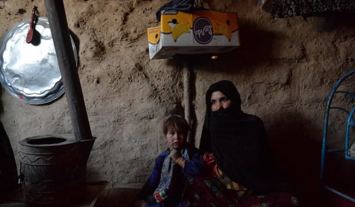 Mother Sabehre, with her 3-year-old daughter, Zakereh, who will be sold into marriage to forgive a debt