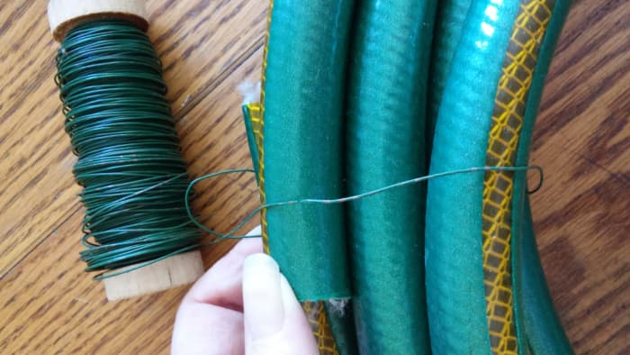 Learn from my error and hide Loop behind hose so you don't see it from the front when wreath is complete. I did adjust later to compensate for that.