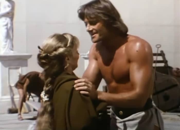 Blind flower seller Nydia (Linda Purl) runs into gladiator Lydon (Duncan Regehr) on the streets of Pompeii