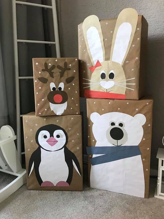 This is an even simpler way to make character gift boxes: Use a solid colour background (even recycled paper bags!), then cut paper into the shapes of snowmen, polar bears, reindeer, etc. and glue it to the boxes.