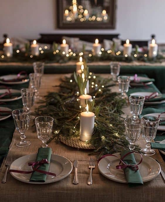 You don't need to own fancy dinnerware to set a gorgeous table. This setting goes all out with the greenery and candles!