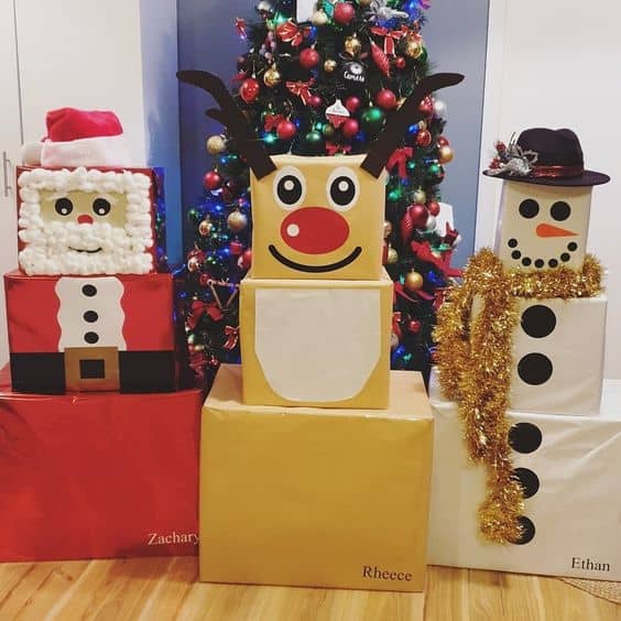 Here's a trio of proud Christmas figures! The Santa Claus has a great beard made from cotton balls, and the snowman's festive scarf is a piece of garland.