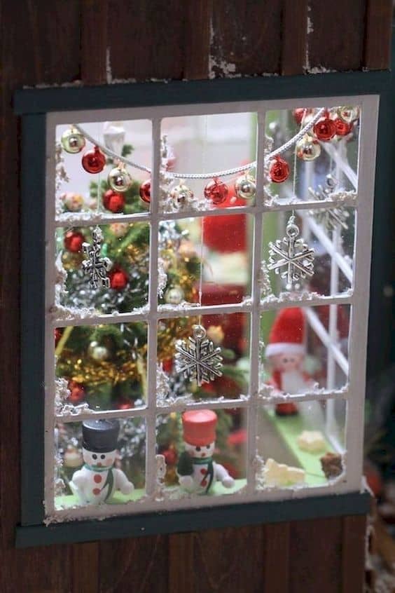 Some wood paneling was added around this lantern, making it look like a peek into a little holiday window.