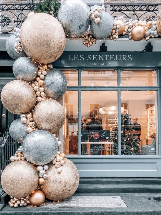 This one is also NOT an at-home DIY, but use this store's amazing stacked bauble display for inspiration! Maybe you could hot-glue some baubles to dowels and hang them up on either side of the window?