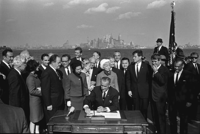 DEMOCRATIC PARTY SIGNS IMMIGRATION ACT OF 1965 TO SECURE A HUGE FUTURE BASE OF POOR VOTERS FOR SOCIALISM
