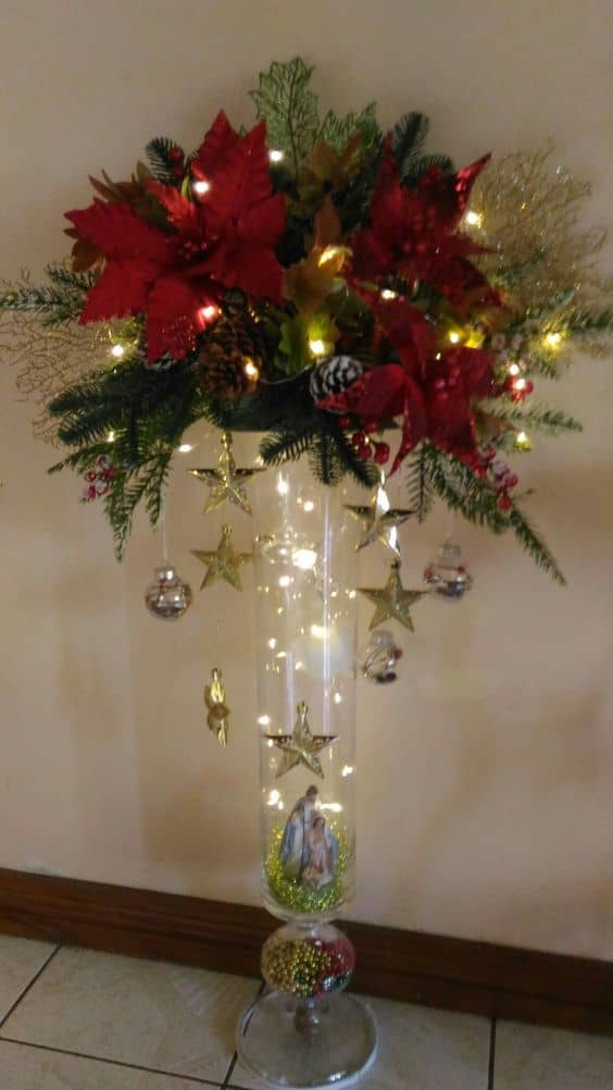 Fill a vase with string lights, baubles and Christmas greens, and put it on your nightstand or dresser.