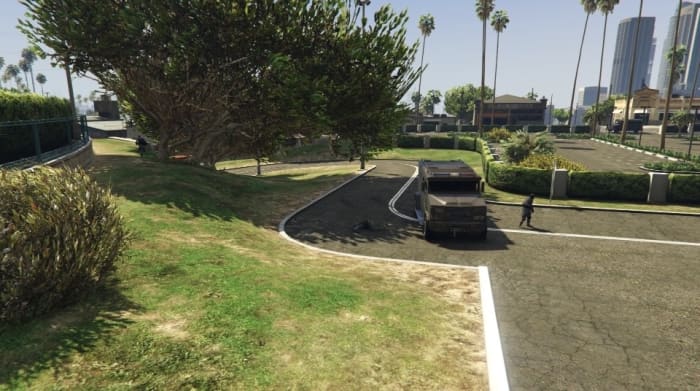 Knock out the NOOSE officer on the left (the van's right) before following the slope around the race track.