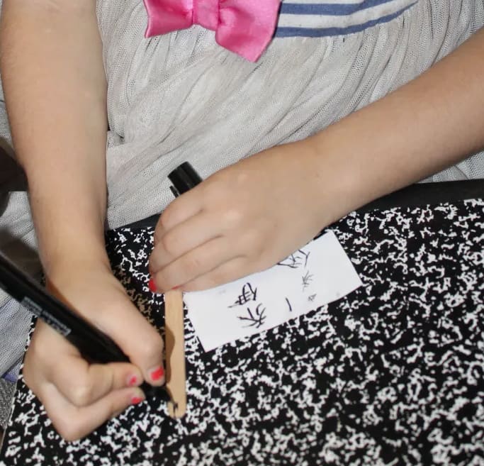 Writing our names in Chinese characters on "bamboo" slips made from a craft/popsicle sticks was one of the activities related to Lao-Tzu and Confucius we did during our History Morning Basket & Activities time.