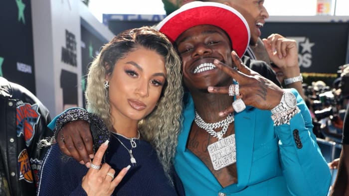 A picture of Dani Leigh and DaBaby on the red carpet for an event in the beginning of their whirlwind situationship.