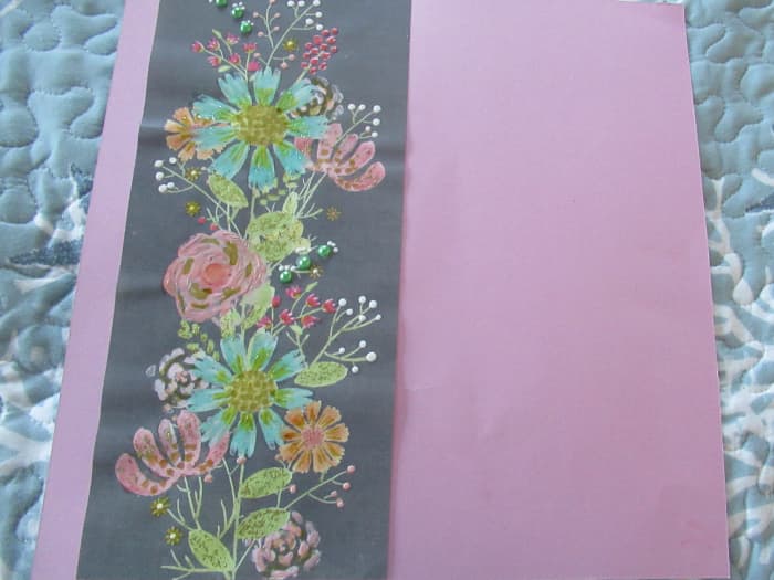 You can create a custom base page in minutes. Add a strip of floral paper to a plain base page. Then embellish the floral sections with Neuvo drops. Let it dry overnght.
