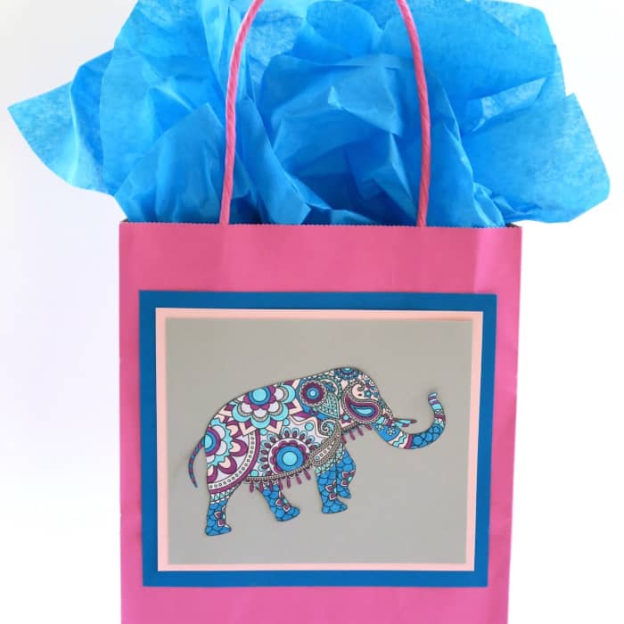 Create a lovely coloring book gift bag-so easy and fun to do. With a little help, your kids can make them too