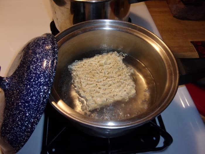When the water in the noodle pot comes to a boil, add the noodles and set a timer for two minutes.