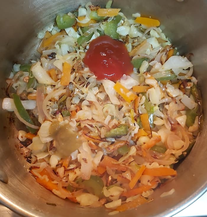 Add 2 teaspoons of tomato sauce, 1 teaspoon of green chilli sauce (or you can use red chilli sauce).