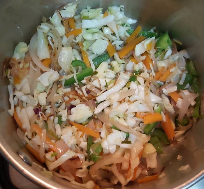 Add chopped cabbage. Fry for 2-3 minutes (or close the lid and cook over medium flame for 2 minutes).