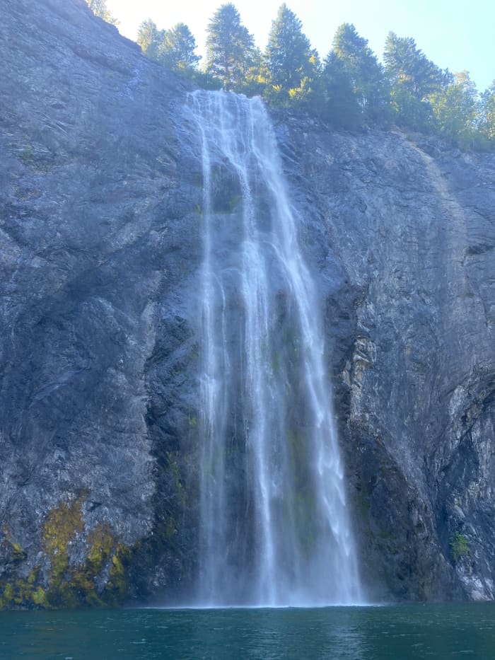 The waters of the PeeWee Falls cascade over a sheer cliff into the Pend Oreille River.