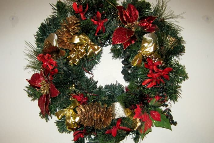 Red & Green Christmas Wreath - gold ribbon, large gold pine cones, silk poinsettia flowers, and greenery.
