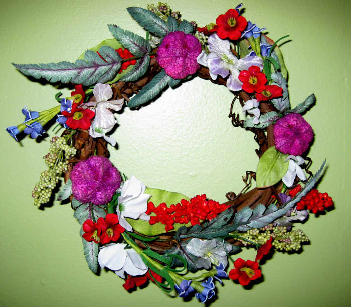 Spring Wreath - crafted using a small vine wreath and adding silk flowers, leaves and pics from other wreaths.
