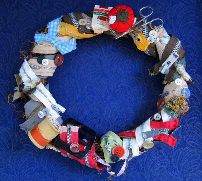 Grandma's Sewing Box Wreath - crafted with items in my Grandma's sewing box. Hot glued and wrapped the items around a 12" vine wreath.