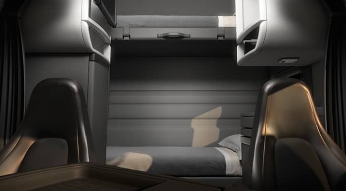 Basic sleeper with bunk beds, cabinets on each side between the front seats and beds.