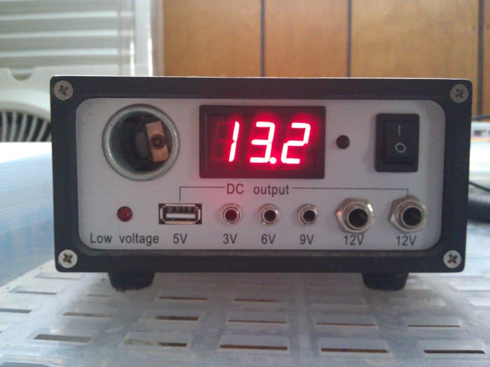 The charge controller and power distribution point that came with my kit. It includes a 12 volt outlet, a USB port, and various other low voltage DC outlets. Also, it features a handy digital display that shows system voltage.