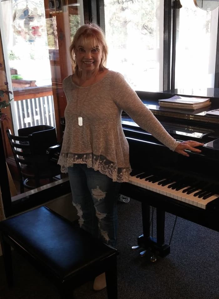 Author sharing her love of piano with visitors from around the world at Idyllwild's popular restaurant in Southern California..