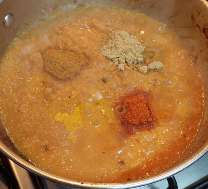 Add 1/2 teaspoon turmeric powder, 1 teaspoon of red chili powder, 2 teaspoons of coriander powder and 1/2 teaspoon garam masala powder. Mix well.